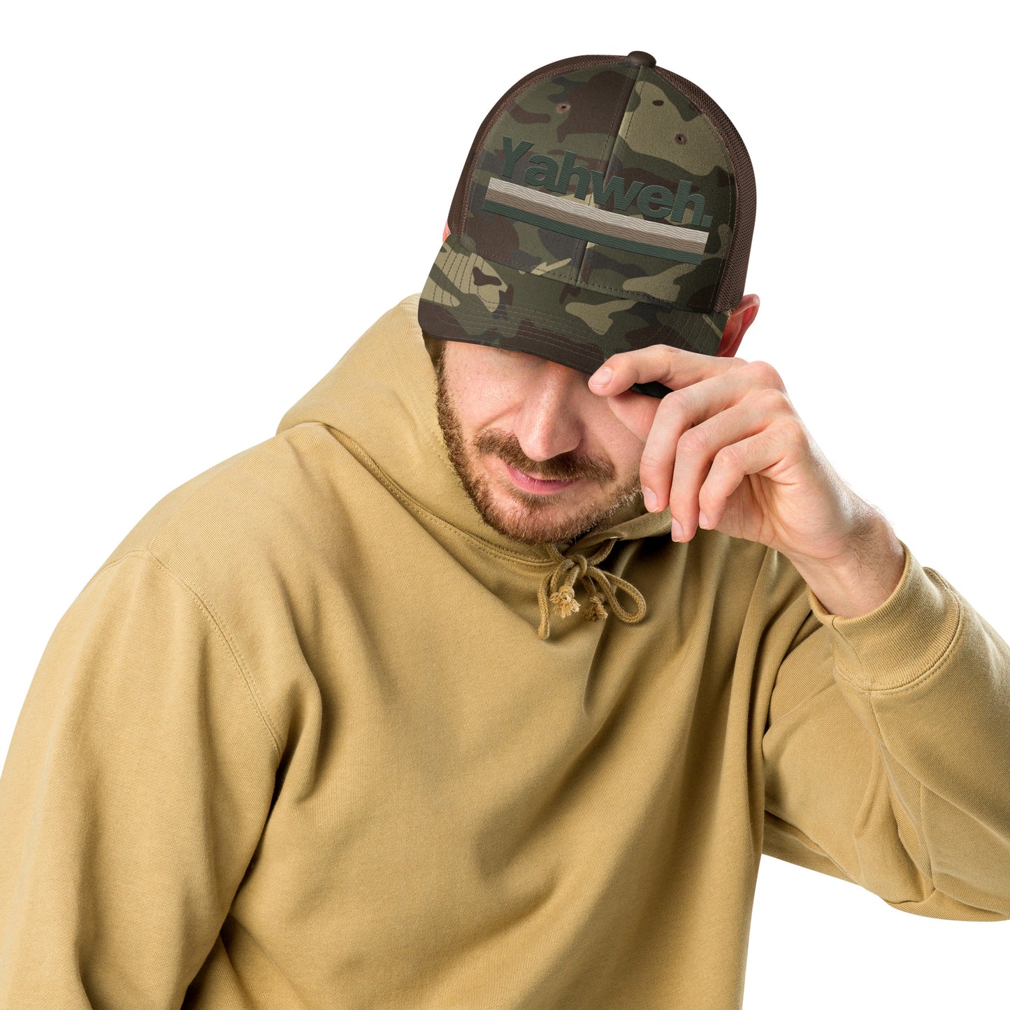 Man wearing the YHWH Camouflage Trucker Hat for Men - Structured Snapback with Embroidered Design, showcasing a casual look that blends fashion and faith. A great way to support small business and connect with the Christian community.