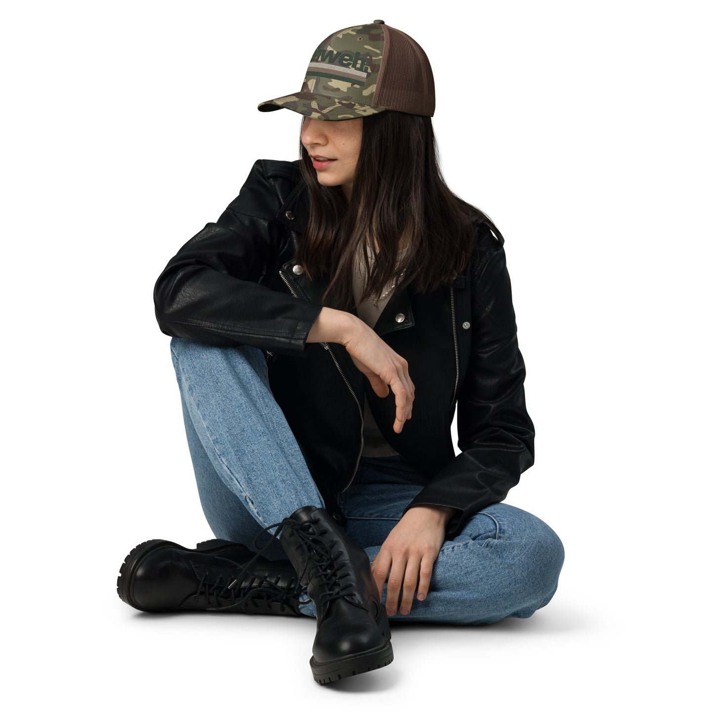 Woman wearing the YHWH Camouflage Trucker Hat for Men, showcasing a stylish look while supporting a veteran-owned small business that embodies christian faith.