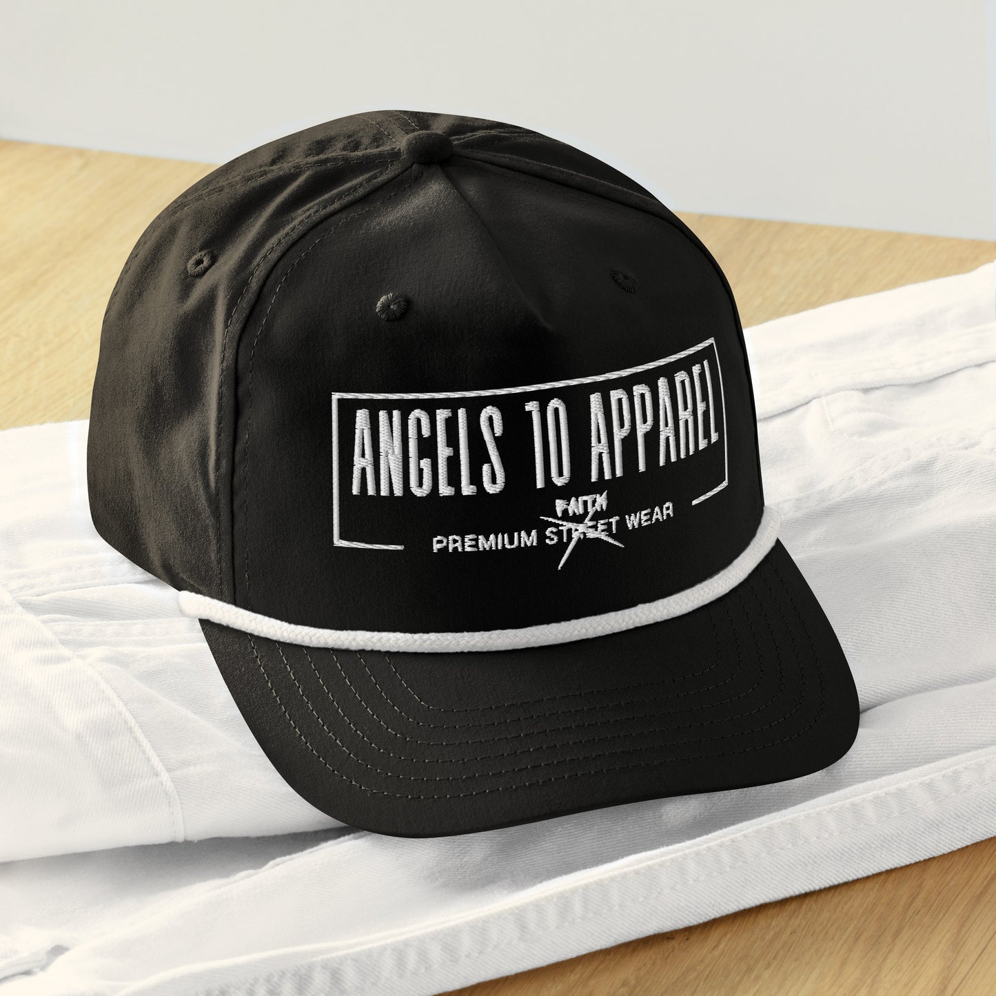 Close-up view of the Premium Unisex Golf Rope Cap for Christians, showcasing its braided rope detail and 'Believe' embroidery from ANGELS 10 APPAREL LLC. A chic accessory for expressing faith while supporting a veteran-owned small business.