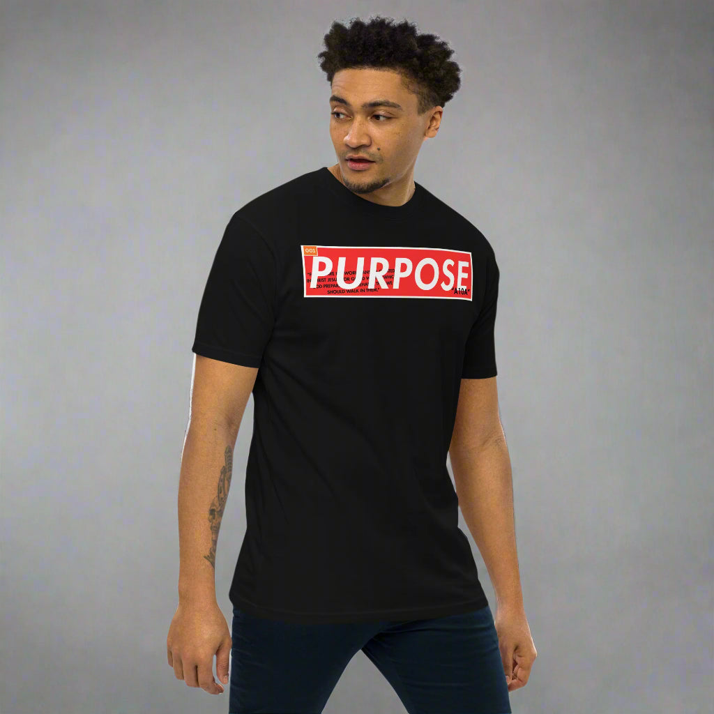 Model wearing the Purpose Premium Unisex T-Shirt with a minimalist 'Purpose' design, showcasing a modern fit. This stylish tee inspires faith and belief in your mission. Support a veteran-owned, small business with this premium apparel.