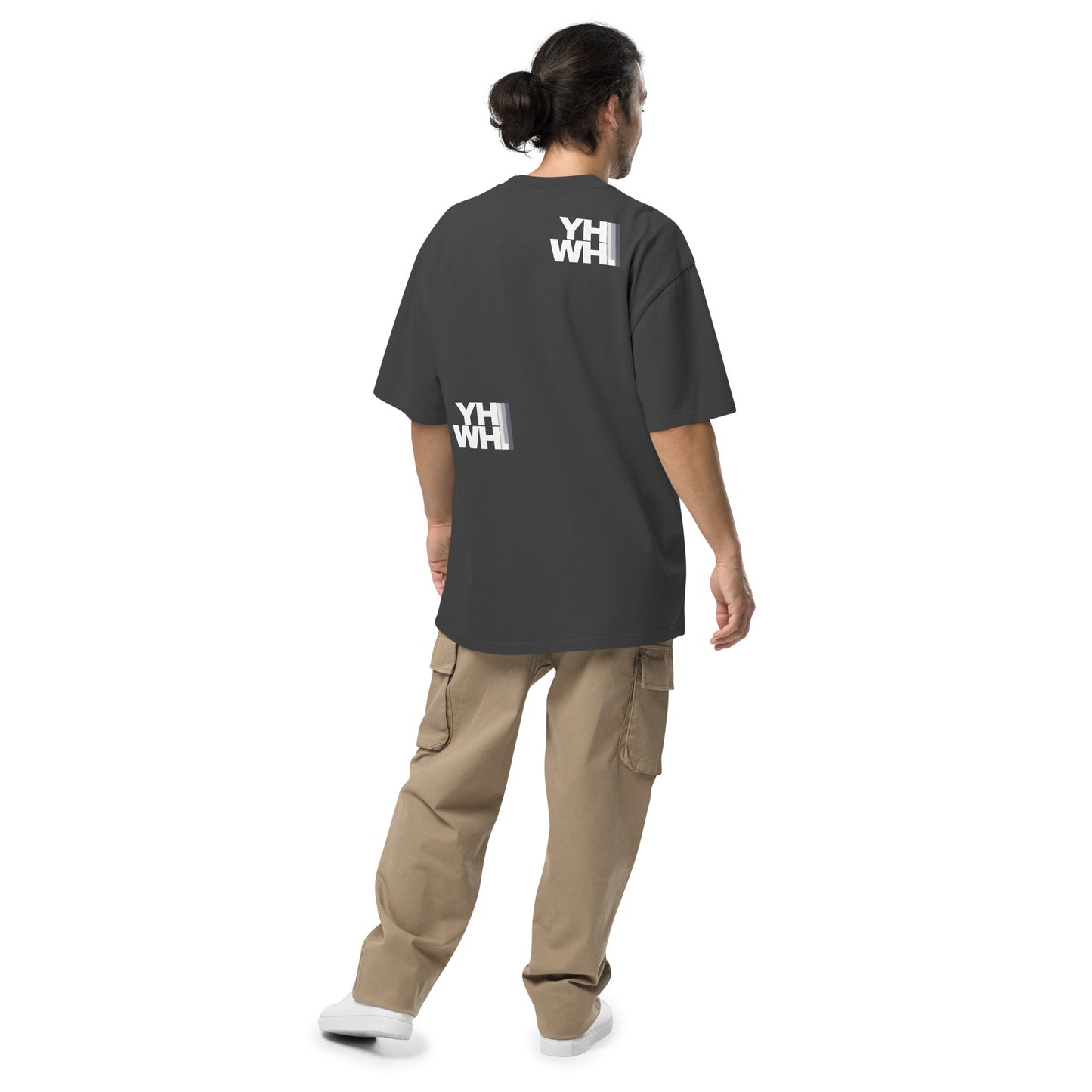 Back view of a model in the YHWH Oversized Unisex Faded T-Shirt, featuring YHWH graphic design that reflects both style and christian beliefs. Support this small, veteran owned business.