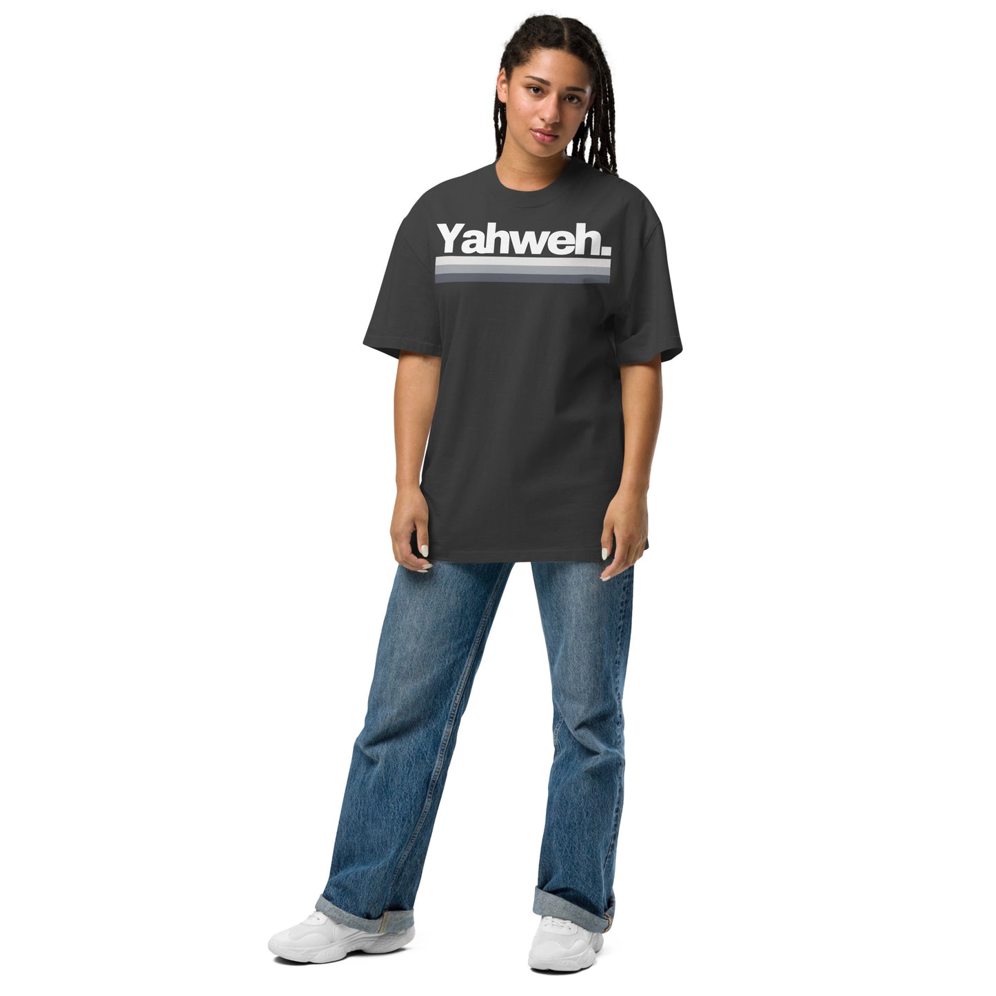 Woman casually dressed in the YHWH Oversized Unisex Faded T-Shirt, blending comfort with a bold statement of faith. A great choice from a small, veteran owned style business.