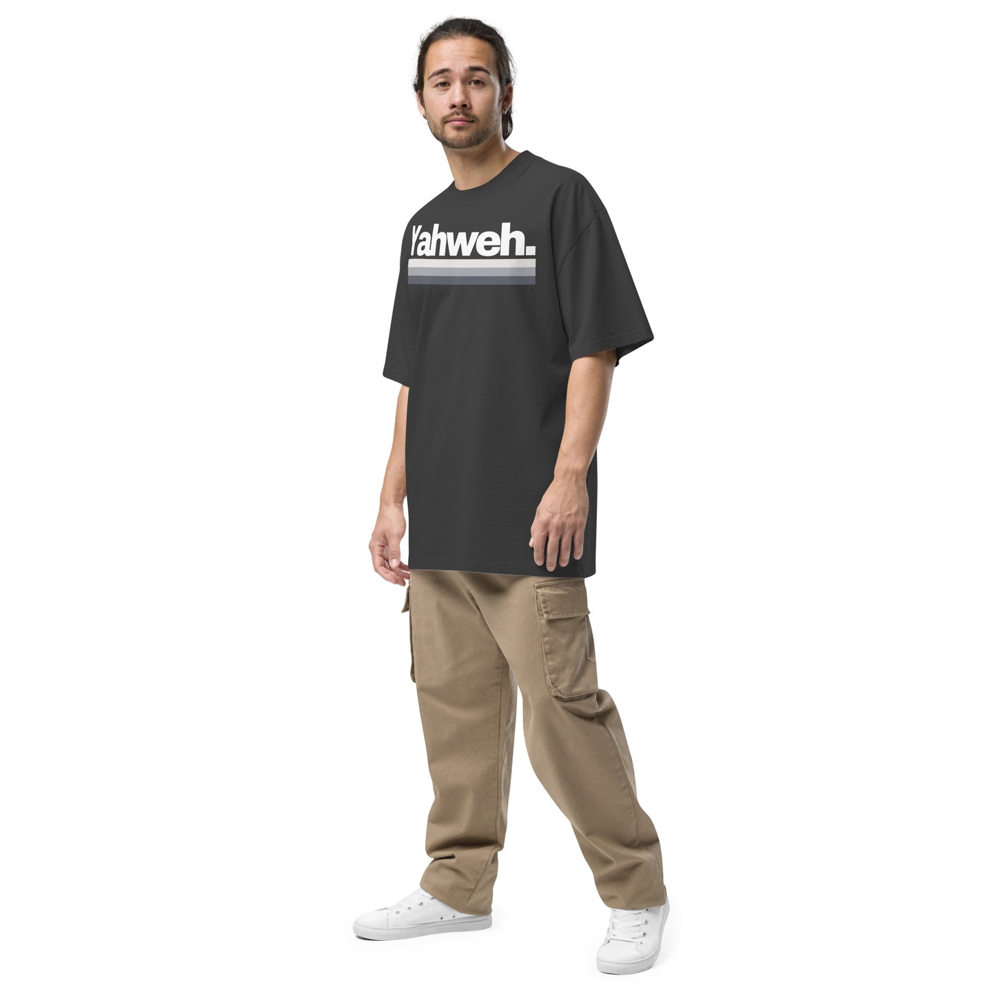 Model wearing the YHWH Oversized Unisex Faded T-Shirt, combining streetwear aesthetics with comfort and faith in a casual style. Proudly support this small business and its veteran ownership.