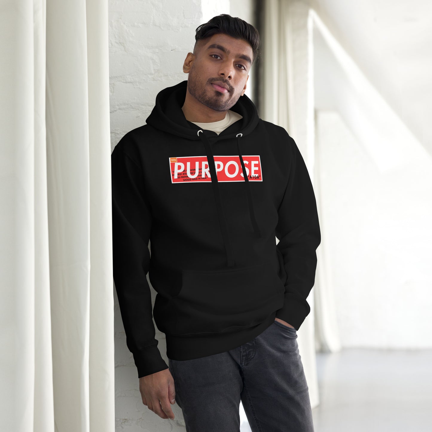 A model wearing the Purpose Premium Unisex Hoodie adds a modern touch to faith-based style. This hoodie reflects confidence for every believer, emphasizing their Christian values while supporting a veteran owned small business.