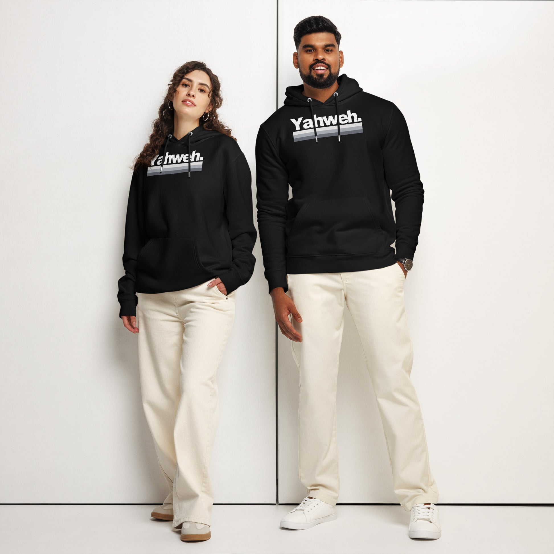 A stylish couple wears the YHWH Oversized Unisex Hoodie in black showcasing the 'Yahweh' design, ideal for those who value faith and individuality. This ensemble promotes support for a veteran-owned small business with a flair for street style.